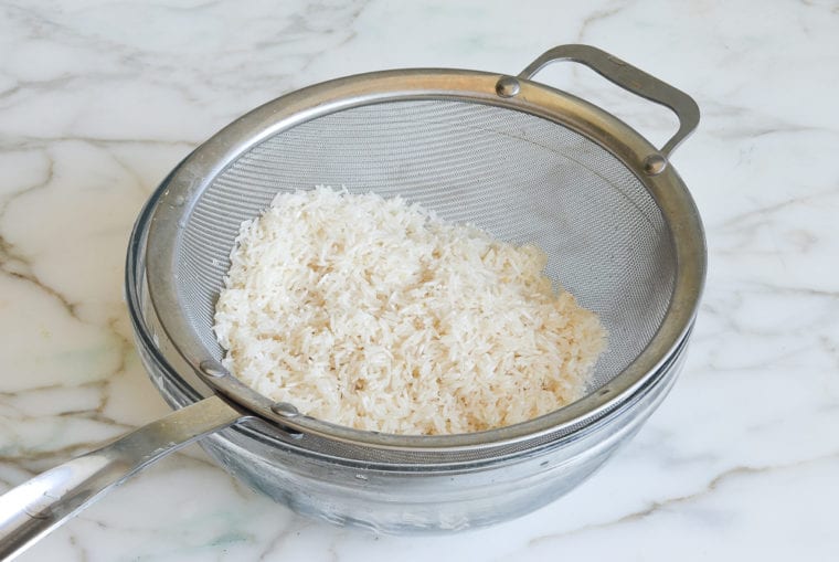 draining basmati rice