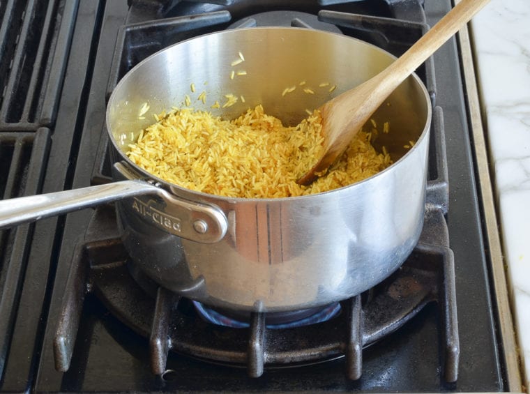 cooking the rice over dry heat