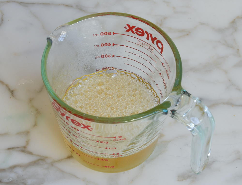 Pale yellow mixture in a measuring cup.