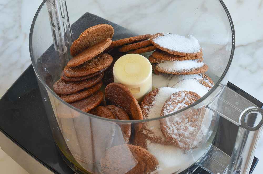 Food processor full of ginger snaps and sugar.