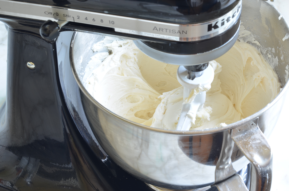 Vanilla buttercream in the bowl of a stand mixer.