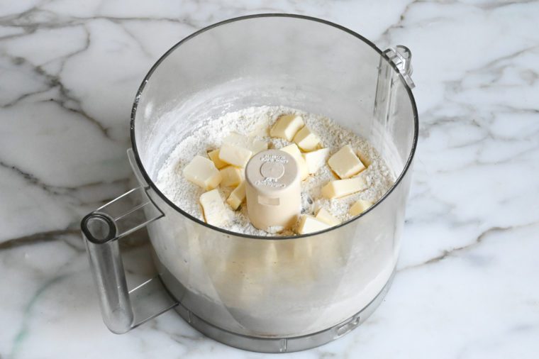 adding chunks of cold butter to flour mixture