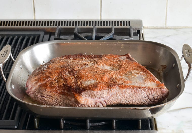 searing the brisket on the stovetop