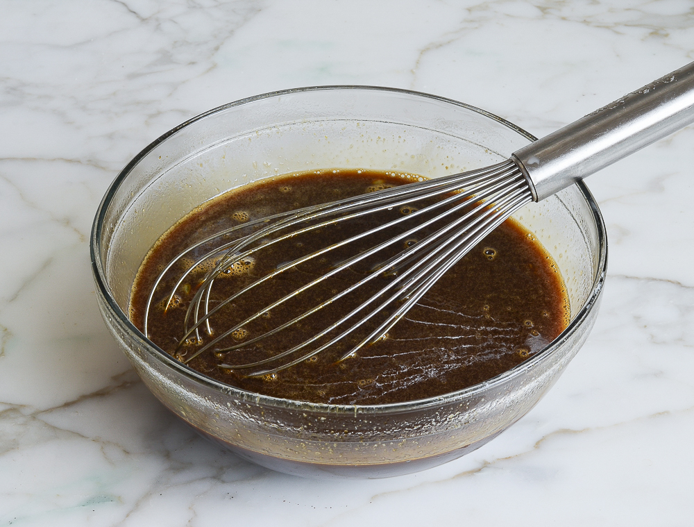 whisking in the brown sugar, molasses, boiling water, and egg