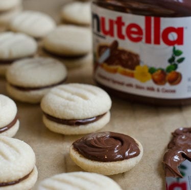 Jar of Nutella with Nutella cookies.