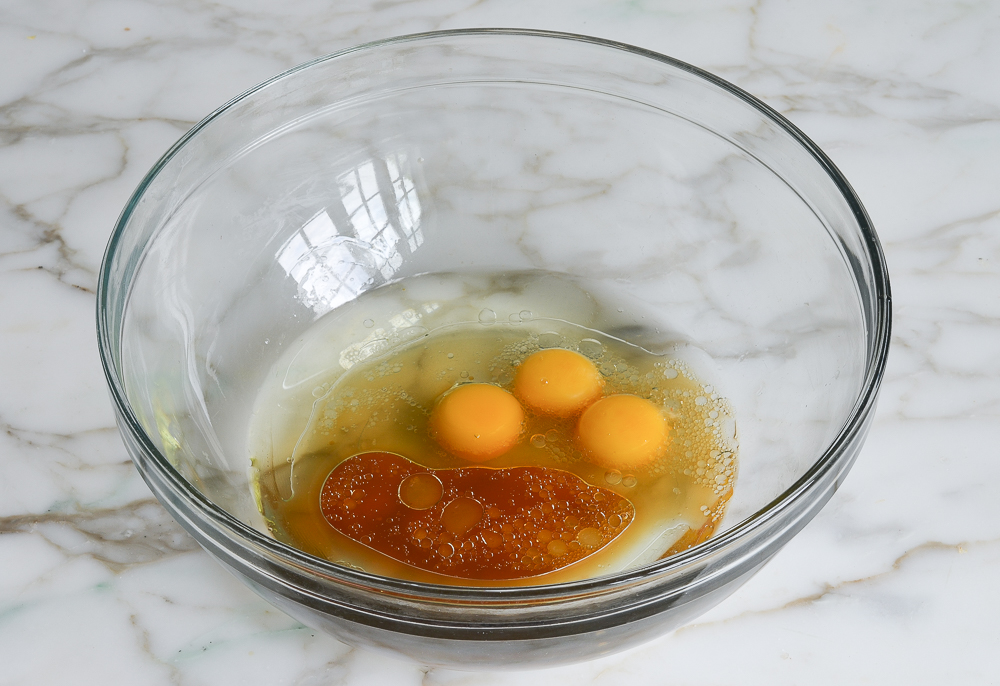 egg yolks, water, and oil in mixing bowl
