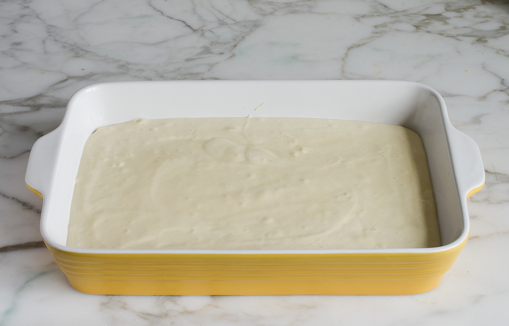 tres leches batter in pan ready to bake