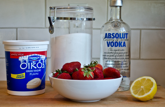 Yogurt ingredients including vodka, strawberries, and lemon.