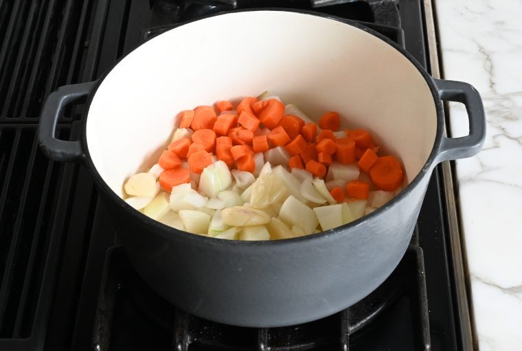 onions, garlic, and carrots in pot