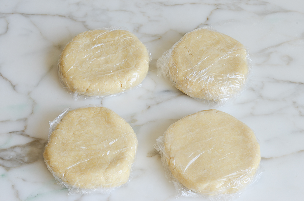 rugelach dough disks wrapped in plastic