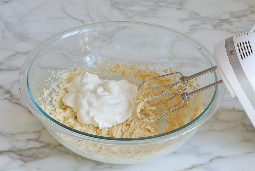 Yogurt in a bowl with a butter mixture.