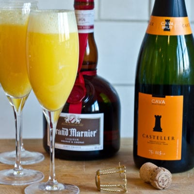 Grand mimosas in champagne glasses.