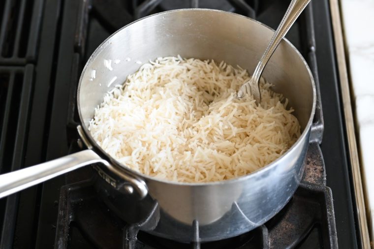 fluffing the basmati rice with a fork