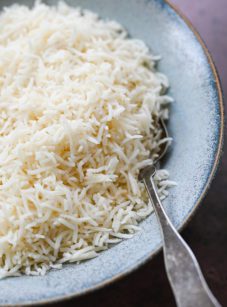 Spoon in a bowl of basmati rice.