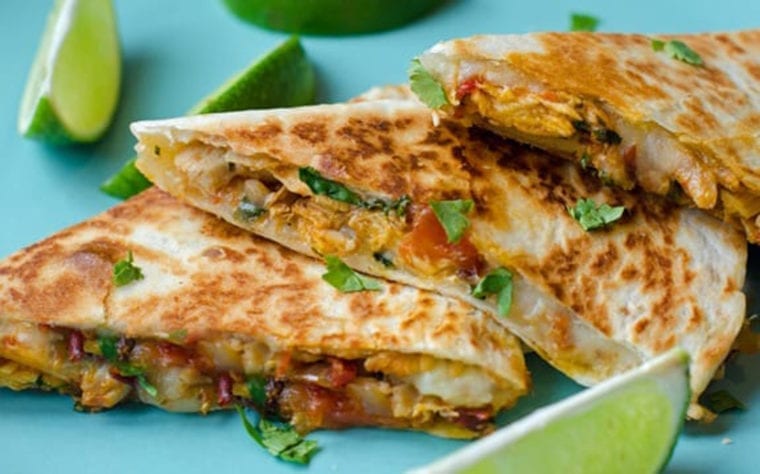 Chipotle chicken quesadillas on a blue plate.