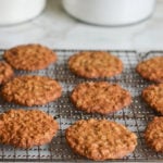 Thin and crispy banana oatmeal cookies on a wire rack.