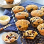 Blueberry muffins on a wire rack.