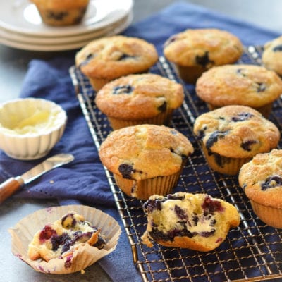 Blueberry muffins on a wire rack.