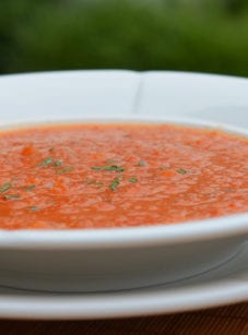 Bowl of chilled roasted red pepper soup.