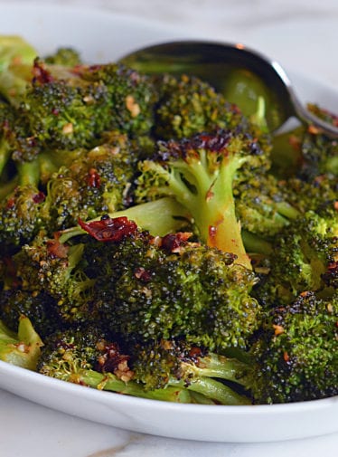Dish of roasted broccoli with chipotle honey butter.
