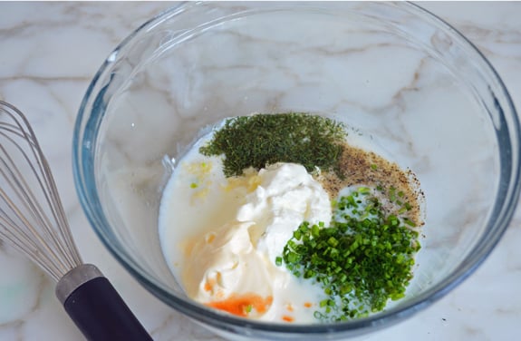 Unmixed dressing ingredients in a bowl.