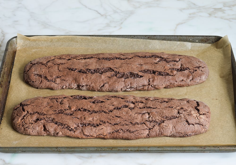 Two baked logs of double chocolate biscotti.
