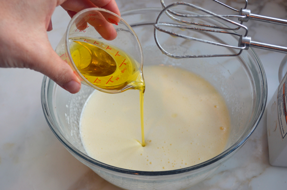 Olive oil being poured into a bowl.
