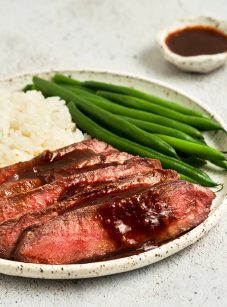 broiled flat iron steak with green beans and rice