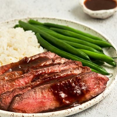 broiled flat iron steak with green beans and rice
