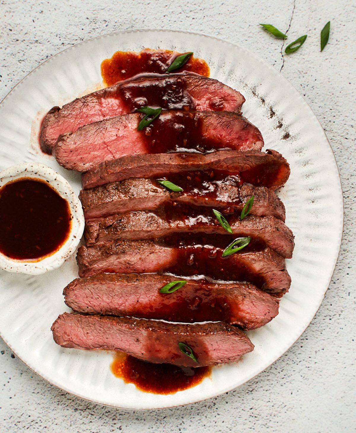broiled flat iron steak on platter