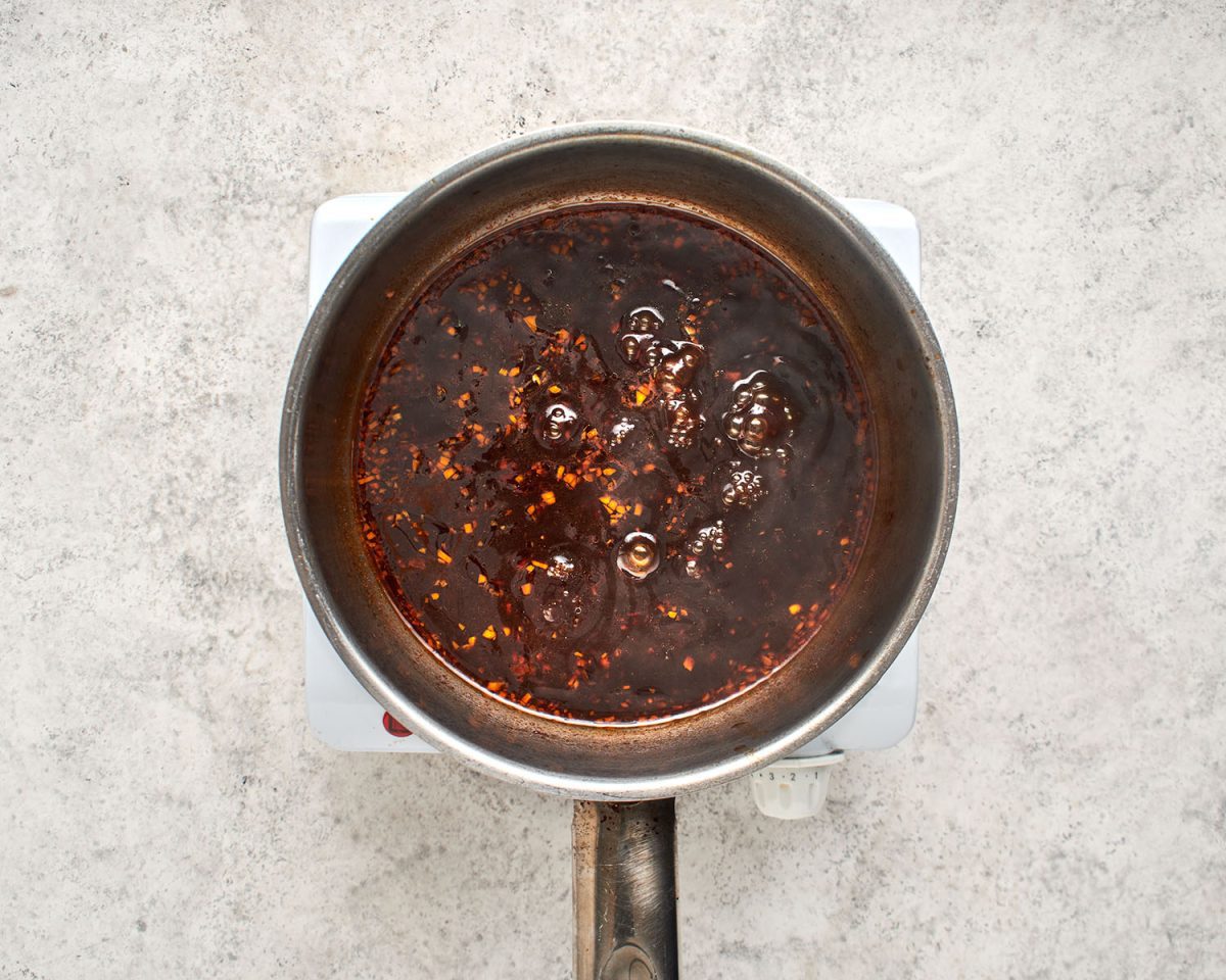 dry Sherry, soy sauce, brown sugar, tomato paste and water added to the saucepan.