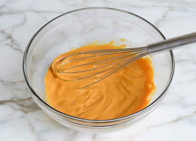 Bowl of whisked wet ingredients.