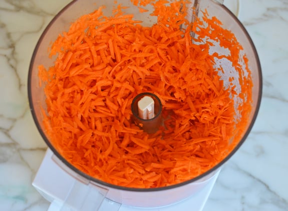 Grated carrots in a food processor.