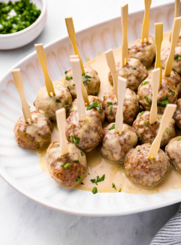 Plate of Swedish meatballs on small skewers.
