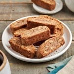 walnut and cinnamon biscotti on a plate with coffee