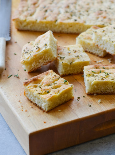 Pieces of focaccia on a cutting board.