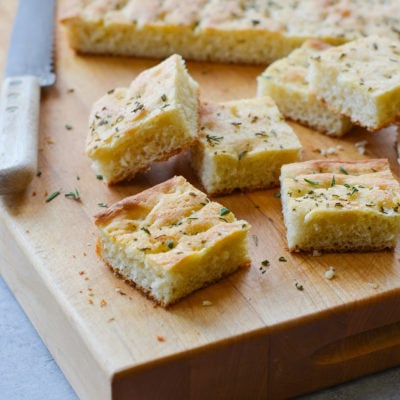 Pieces of focaccia on a cutting board.