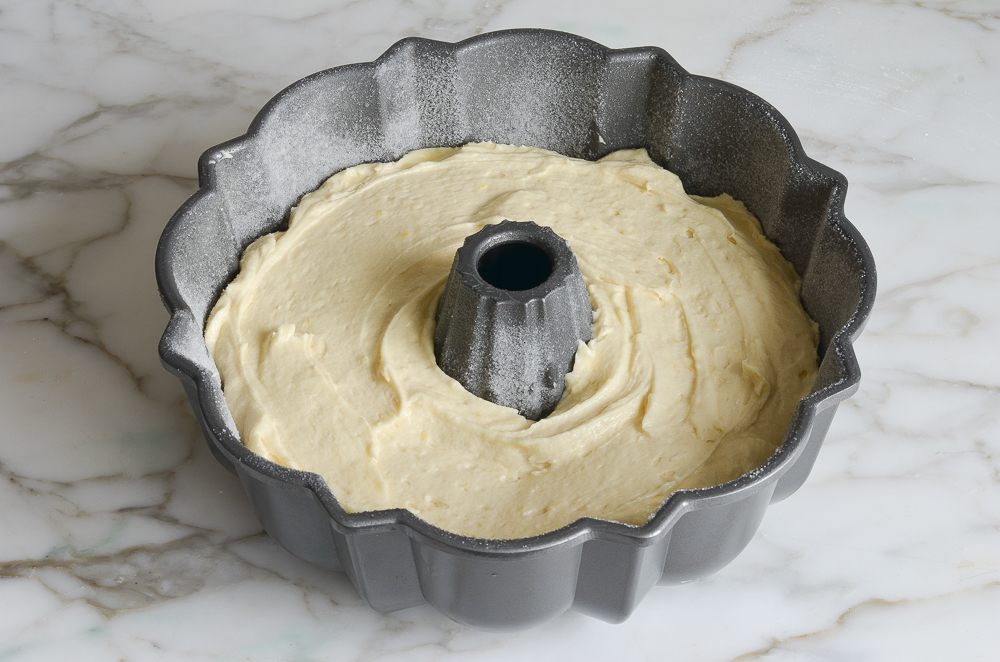 lemon pound cake batter in prepared Bundt pan