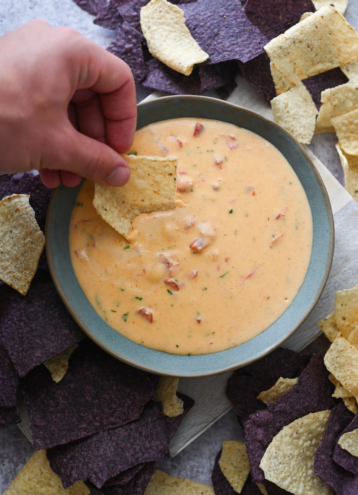 chile con queso with chips on platter