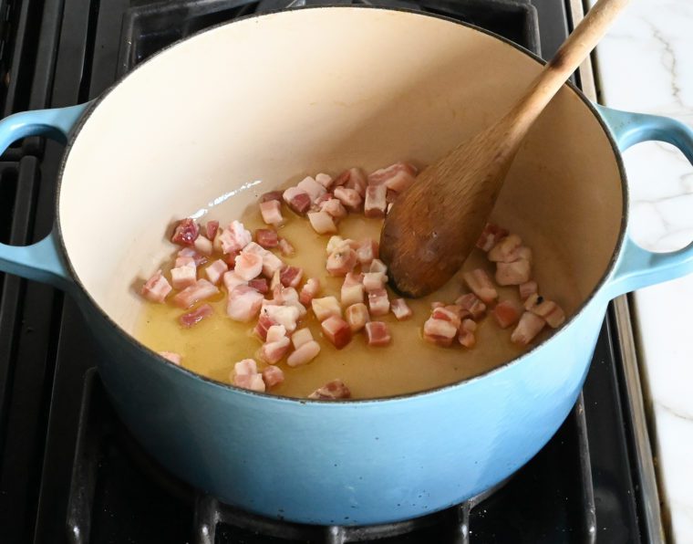pancetta and olive oil in pot.