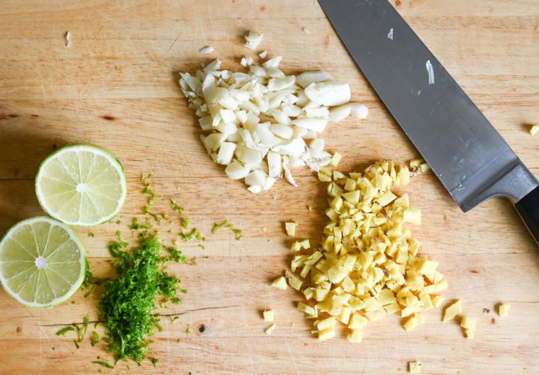 lime, ginger and garlic on cutting board