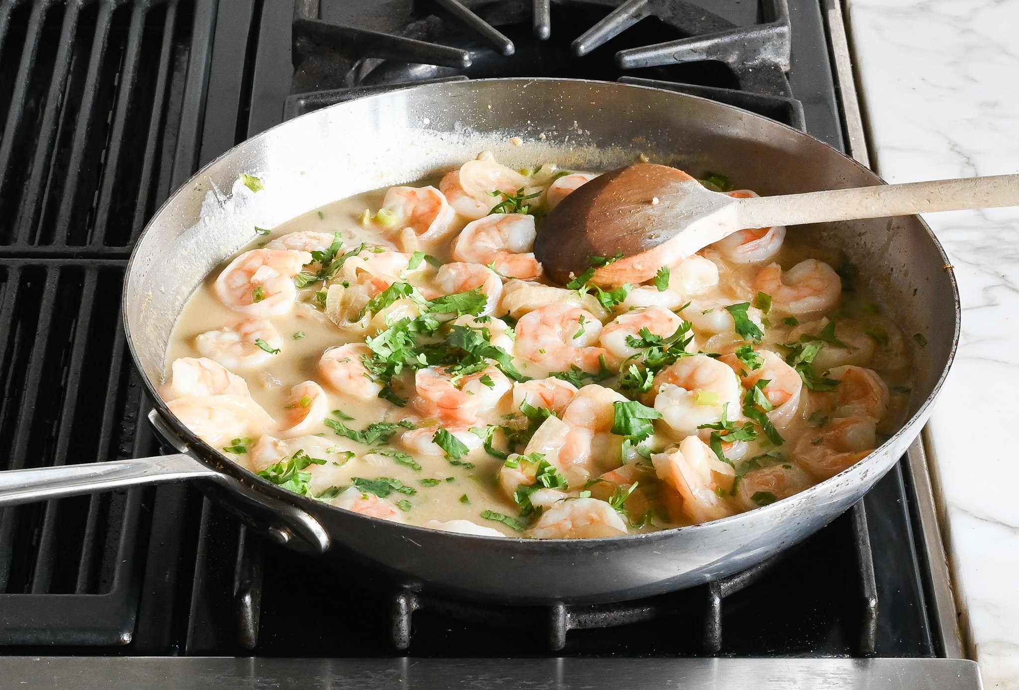 Cilantro and shrimp in a coconut milk mixture.