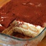 Baking dish of partially-served tiramisu.