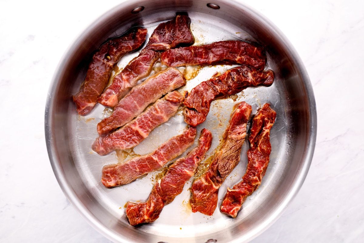 cooking beef in pan