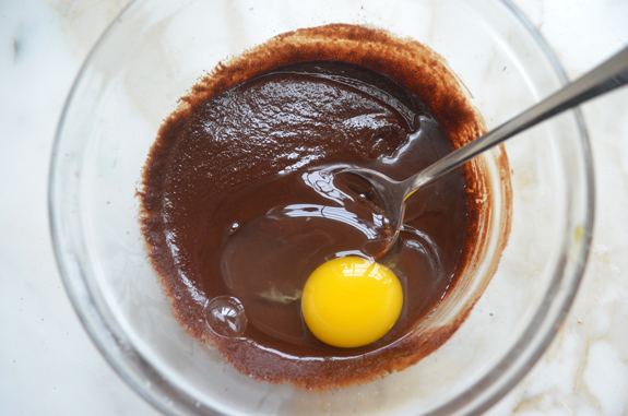 Egg in a bowl of chocolate.