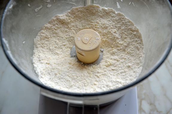 Butter and flour mixture in a food processor that resembles coarse meal.