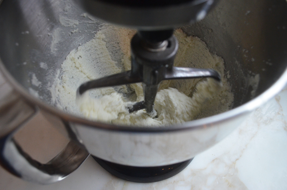 Stand mixer creaming butter and sugar.