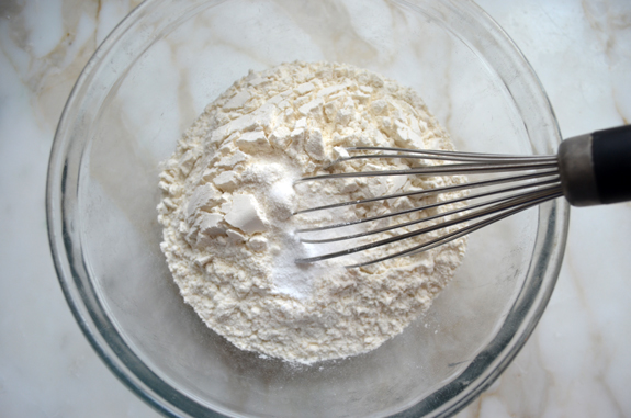 Whisk in a bowl of unmixed dry ingredients.