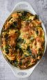 Spinach and cheese strata in a baking dish.