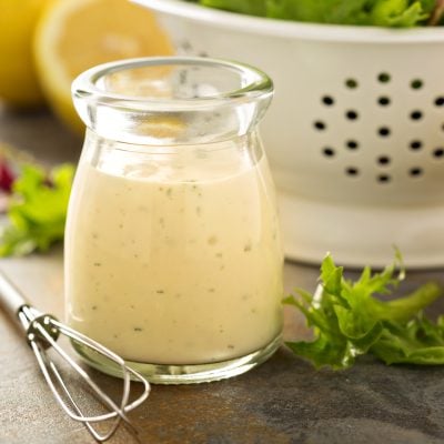 Small glass of creamy Greek yogurt dressing.